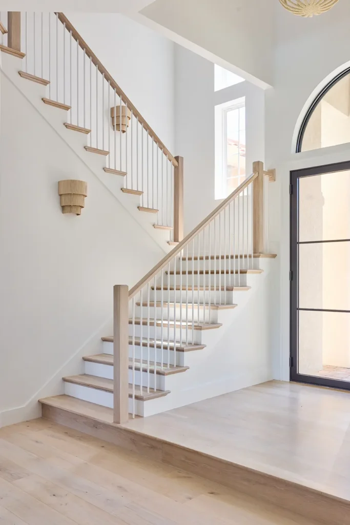 Stairway and entryway of a custom home built by Alesch Luxury Custom Builders in Ponte Vedra Beach a custom builder who also serves clients with Architectural design services