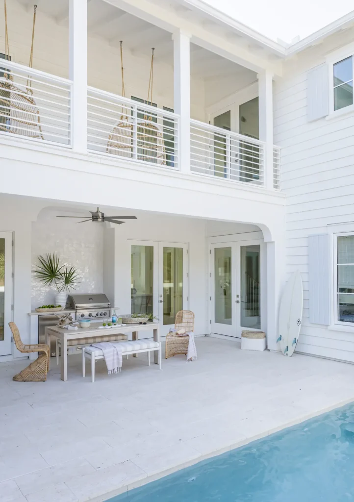 Backyard pool and rear exterior of a custom-built luxury home in Ponte Vedra Beach by Alesch Luxury Custom Builders building custom homes throughout Ponte Vedra, Jacksonville, and the Beaches in Florida