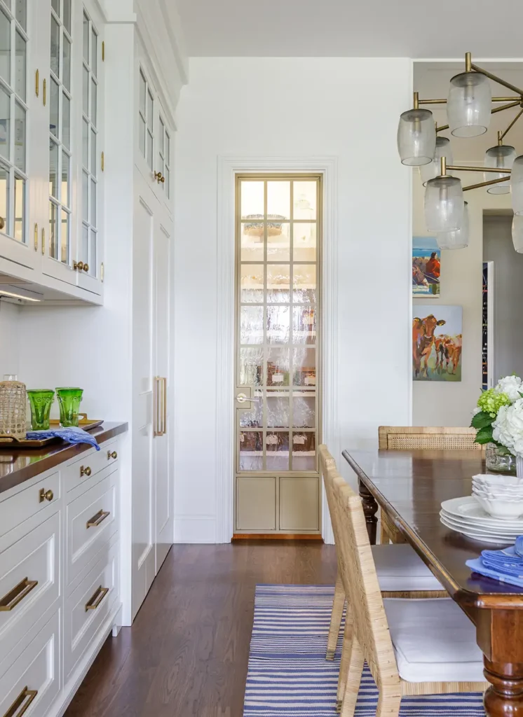 Elegant custom glass pantry door in a coastal kitchen and dining room renovation by Alesch Custom Builders in Ponte Vedra. Kitchen & Dining Room Renovation Ponte Vedra Custom Pantry Door - Alesch Luxury Custom Builders