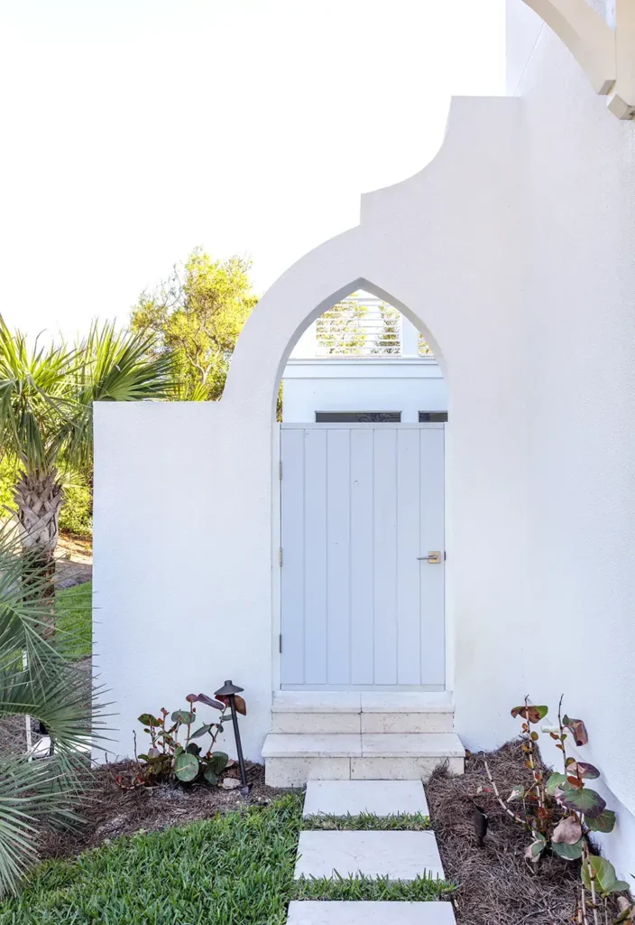 ponte vedra entry pool architectural design Alesch custom homes Architectural pool entry with curved design and coastal landscaping in Ponte Vedra custom home