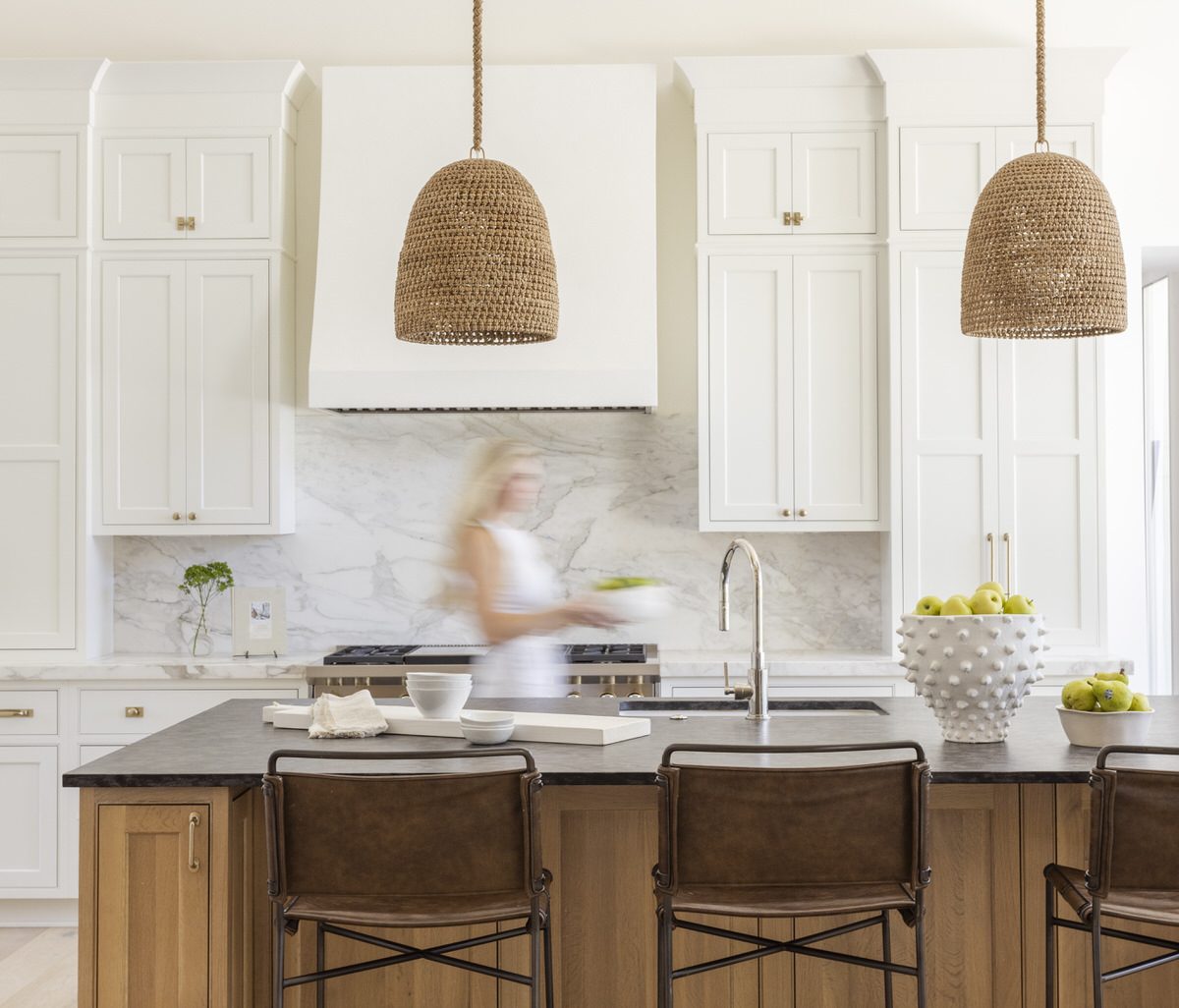 Custom home kitchen with white oak island, marble backsplash, and woven pendants by Alesch, custom home builder in the Jacksonville area