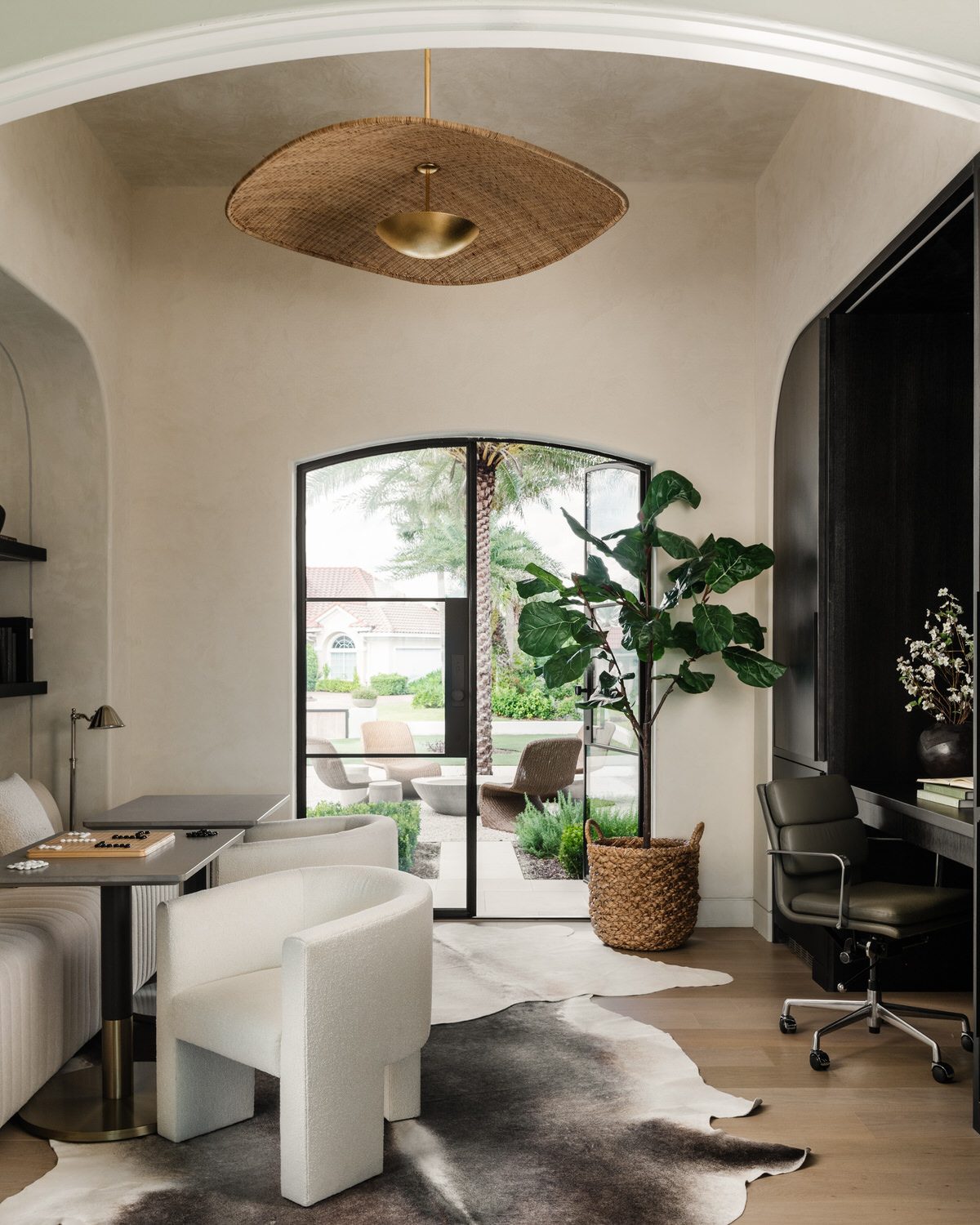 design build home office arched doorway alesch jacksonville Home office with plaster arch, woven pendant, and arched glass door to the patio, designed and built by Alesch in Northeast Florida