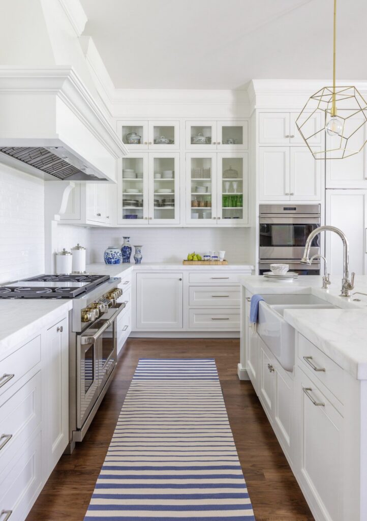 Range wall and custom cabinetry in a renovated kitchen by Alesch